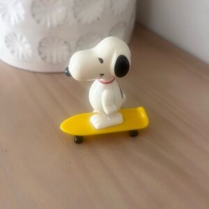 Vintage 1960s Peanuts Snoopy Wind Up on Yellow Skateboard